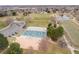 Aerial view showing community amenities featuring sports courts and a green space with walking path at 2924 E 116Th Pl, Thornton, CO 80233