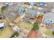 Aerial view showcasing backyard with playset, storage sheds, water feature, and fenced yard at 2924 E 116Th Pl, Thornton, CO 80233