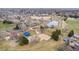 Aerial view shows neighborhood park with playground, volleyball court, and community picnic shelter at 2924 E 116Th Pl, Thornton, CO 80233