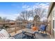 Outdoor deck with seating, blue patterned rug, and neighborhood views for relaxation and entertaining at 2924 E 116Th Pl, Thornton, CO 80233