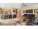 Comfortable living room featuring modern furnishings, tile floors, and a view into the kitchen at 2924 E 116Th Pl, Thornton, CO 80233