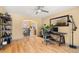 Bright Living Room with wood floors, ceiling fan and view into the dining area and kitchen at 2924 E 116Th Pl, Thornton, CO 80233