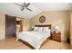 Serene primary bedroom with hardwood floors, a sliding barn door, and neutral color palette at 2924 E 116Th Pl, Thornton, CO 80233