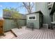 Charming backyard with wooden patio, shed, and comfortable bench at 34 Benthaven Pl, Boulder, CO 80305