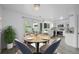 Dining room with table set, chandelier, and sliding glass doors leading to patio at 34 Benthaven Pl, Boulder, CO 80305