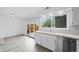 Kitchen features a stainless steel dishwasher and a view of the back patio from the sink at 34 Benthaven Pl, Boulder, CO 80305