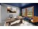 Home office features a wooden desk, gray chair, and bright windows at 34 Benthaven Pl, Boulder, CO 80305