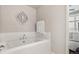 Clean bathroom featuring a soaking tub with white subway tile surround at 6946 W Alaska Dr, Lakewood, CO 80226