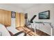 Bedroom featuring exercise equipment, sliding closet doors, and natural light at 6946 W Alaska Dr, Lakewood, CO 80226