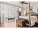 Comfortable bedroom with large window, hardwood floors, and ample natural light at 6946 W Alaska Dr, Lakewood, CO 80226