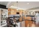 Modern kitchen with stainless steel appliances, granite countertops, and an open layout with barstool seating at 6946 W Alaska Dr, Lakewood, CO 80226