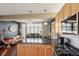 Modern kitchen with stainless steel appliances, granite countertops, and a bright, open layout at 6946 W Alaska Dr, Lakewood, CO 80226
