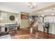 Inviting living area with hardwood floors, a dining area, and staircase, perfect for entertaining and daily living at 6946 W Alaska Dr, Lakewood, CO 80226