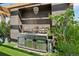 Stainless steel outdoor kitchen boasts granite countertops and ample storage space perfect for entertaining at 6946 W Alaska Dr, Lakewood, CO 80226
