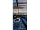 Charming rooftop patio features an outdoor fire pit, comfortable seating, and great city views at 6946 W Alaska Dr, Lakewood, CO 80226