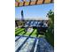 Seating area with fire pit under pergola covered rooftop deck with potted plants at 6946 W Alaska Dr, Lakewood, CO 80226