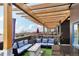 Relax and enjoy the rooftop deck's plush outdoor furniture, shade and lovely neighborhood views at 6946 W Alaska Dr, Lakewood, CO 80226