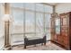 Bright bedroom with large windows, natural light, and hardwood floors at 6946 W Alaska Dr, Lakewood, CO 80226