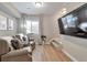Relaxing basement media room with theater seating and a large tv at 15295 W 68Th Pl, Arvada, CO 80007