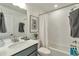 Clean bathroom featuring modern fixtures, a shower-tub combo, and a stylish vanity at 15295 W 68Th Pl, Arvada, CO 80007