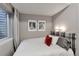 Relaxing bedroom with natural light, stylish wall art, and modern decor at 15295 W 68Th Pl, Arvada, CO 80007