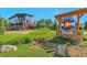 The Colorado Tap House has stunning architecture, manicured landscaping, and a rustic stone sign at 15295 W 68Th Pl, Arvada, CO 80007