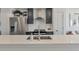 Modern kitchen with stainless steel appliances, sleek countertops, and stylish cabinetry at 15295 W 68Th Pl, Arvada, CO 80007