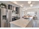 Bright, modern kitchen features stainless steel appliances, a center island, and an open-concept design at 15295 W 68Th Pl, Arvada, CO 80007