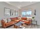 Cozy living room filled with natural light, comfortable seating and stylish decor at 15295 W 68Th Pl, Arvada, CO 80007