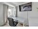 Modern office space with a sleek desk, comfortable chair, and abundant natural light at 15295 W 68Th Pl, Arvada, CO 80007