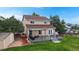 Aerial view of a well-maintained backyard featuring a deck, storage shed, and lush greenery, creating a serene outdoor retreat at 7270 Marmot Ridge Pl, Littleton, CO 80125