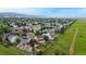 Panoramic aerial view showcasing the neighborhood's layout, green spaces, and mountain views in the distance at 7270 Marmot Ridge Pl, Littleton, CO 80125