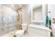 Modern bathroom featuring a glass-enclosed shower and a stylish vanity with marble countertop at 7270 Marmot Ridge Pl, Littleton, CO 80125