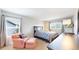 Inviting bedroom features comfortable seating and large windows for plenty of natural light at 7270 Marmot Ridge Pl, Littleton, CO 80125