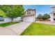 Beautiful two-story home with a well-maintained lawn and an attached two-car garage at 7270 Marmot Ridge Pl, Littleton, CO 80125