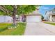 Charming two-story home featuring a manicured lawn, attached garage, and inviting front porch, ideal for suburban living at 7270 Marmot Ridge Pl, Littleton, CO 80125