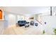 Open-concept living room with tile floors, a comfortable sofa and stylish furnishings at 7270 Marmot Ridge Pl, Littleton, CO 80125