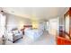 Spacious main bedroom featuring neutral tones, wall decor, and large windows for natural light at 7270 Marmot Ridge Pl, Littleton, CO 80125