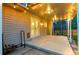 Covered back porch with string lights and an outdoor space at 8132 Lodgepole Trl, Lone Tree, CO 80124