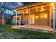 View of the covered patio with outdoor lights and a landscaped backyard at 8132 Lodgepole Trl, Lone Tree, CO 80124