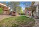 View of the backyard and patio area showing grass and a playhouse at 8132 Lodgepole Trl, Lone Tree, CO 80124
