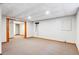 Large basement area with carpet and an open floor plan at 8132 Lodgepole Trl, Lone Tree, CO 80124