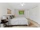Bedroom with a neutral color scheme and large window with natural light at 8132 Lodgepole Trl, Lone Tree, CO 80124