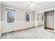 Spacious bedroom with carpet, white trim, and mirrored closet at 8132 Lodgepole Trl, Lone Tree, CO 80124