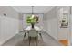 Dining room with wainscoting, neutral colors, and large window at 8132 Lodgepole Trl, Lone Tree, CO 80124