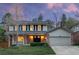 Charming two-story home featuring a brick facade, manicured lawn, and a welcoming front entrance at 8132 Lodgepole Trl, Lone Tree, CO 80124