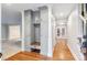 Welcoming foyer with hardwood floors, custom built-in storage, and a view to the backyard at 8132 Lodgepole Trl, Lone Tree, CO 80124