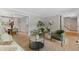 Living room with an open floor plan, neutral colors, and plush seating at 8132 Lodgepole Trl, Lone Tree, CO 80124