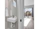 Small bathroom with a modern sink and a window at 6025 Ames St # A, Arvada, CO 80003