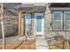Modern front entrance with a white door and wood accents at 6025 Ames St # A, Arvada, CO 80003
